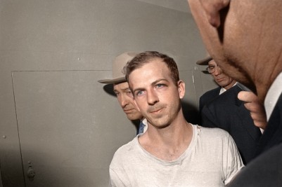 6. Lee Harvey Oswald, 1963, being transported to questioning before his murder trial
